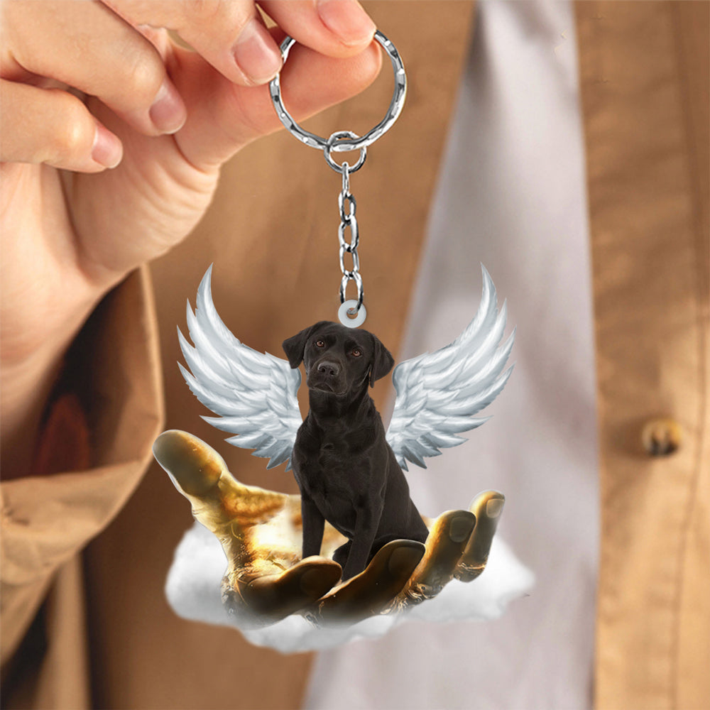 Black Labrador On The Hands Of Jesus Key chain