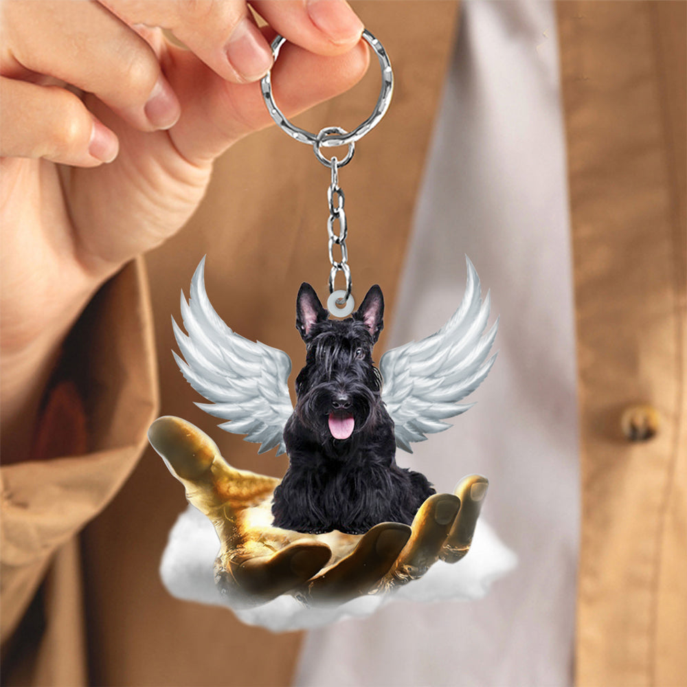 Scottish Terrier On The Hands Of Jesus Key chain