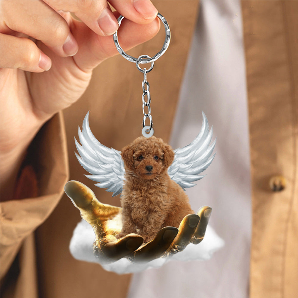 Toy Poodle On The Hands Of Jesus Key chain